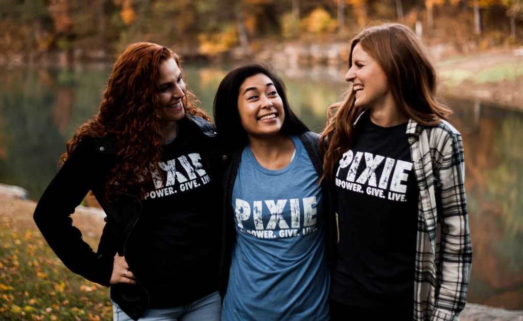 girls wearing pixie t-shirts smiling