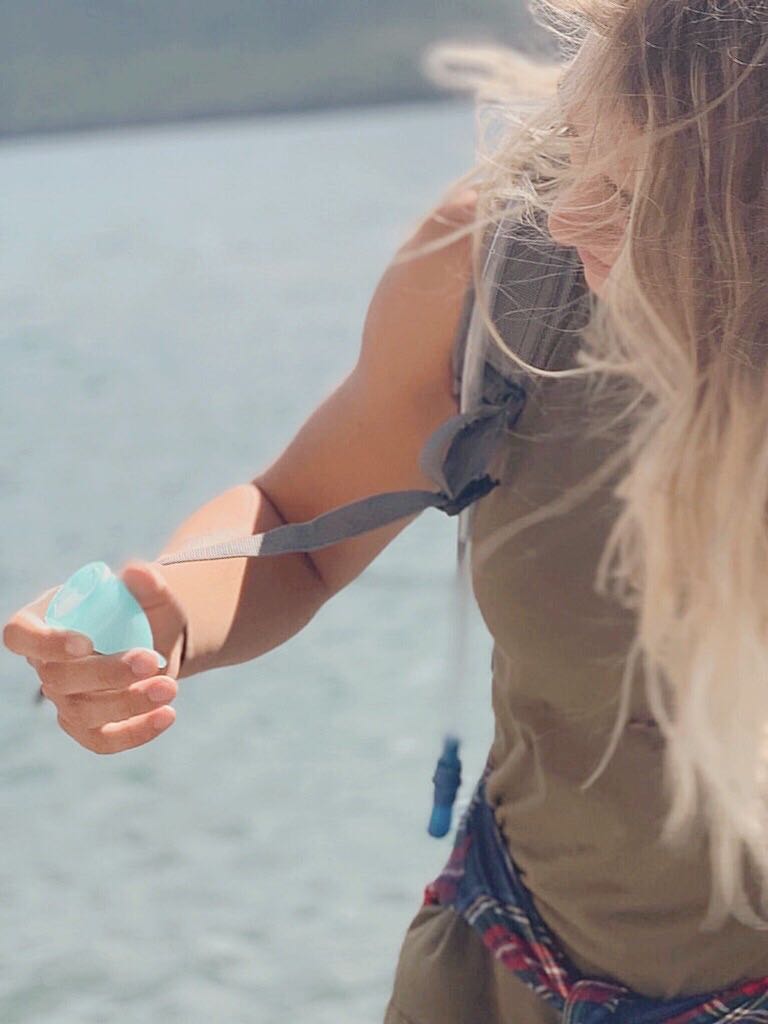 girl holding menstrual cup