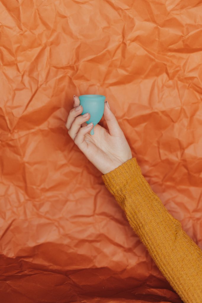 holding menstrual cup