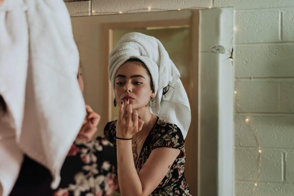 Woman getting ready in bathroom, self-care for your vagina