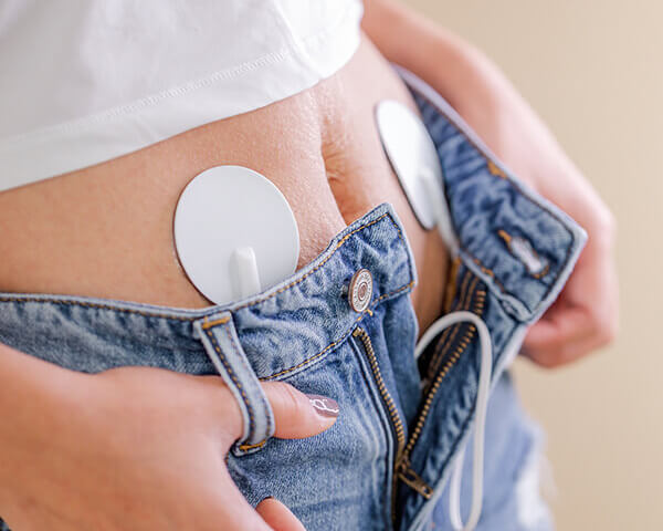 Place the gel-covered pulse pads on your abdomen or lower back.