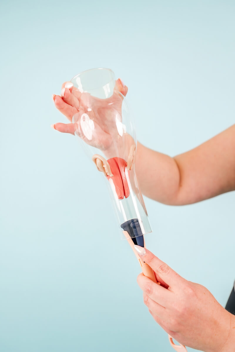 Illustration showing a woman's hands holding the Pixie Cup Applicator during insertion, ensuring easy and comfortable use.