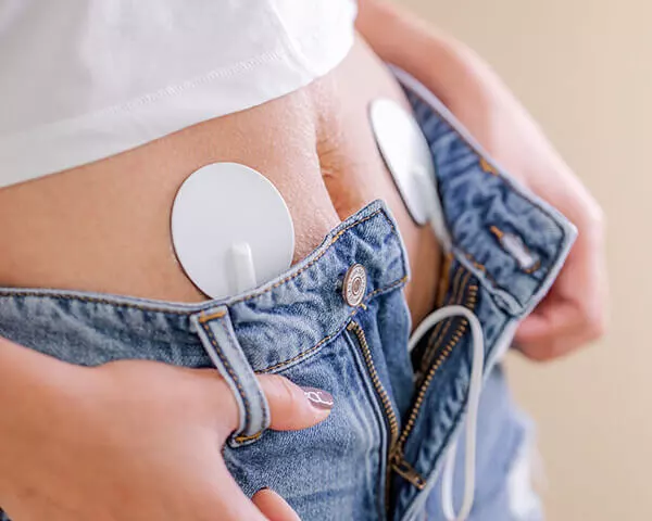 Place the gel-covered pulse pads on your abdomen or lower back.